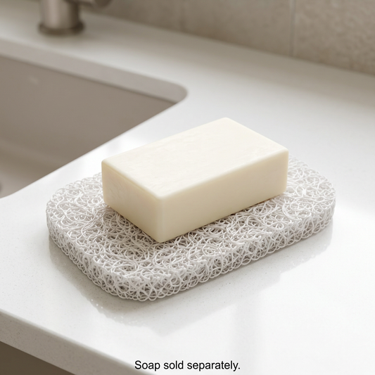 Soap resting directly on the white soap saver pad, without a dish